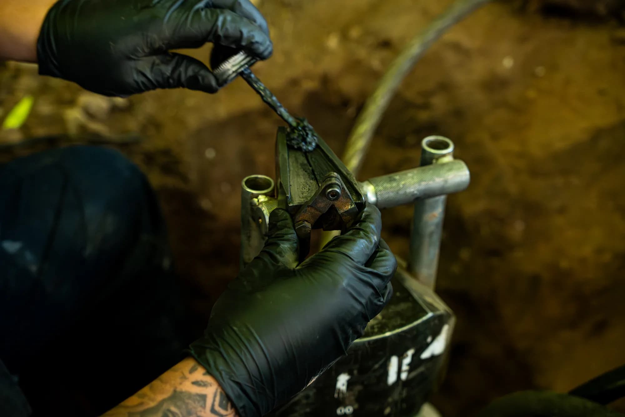 Close-up of professional pipe repair tools on a job site